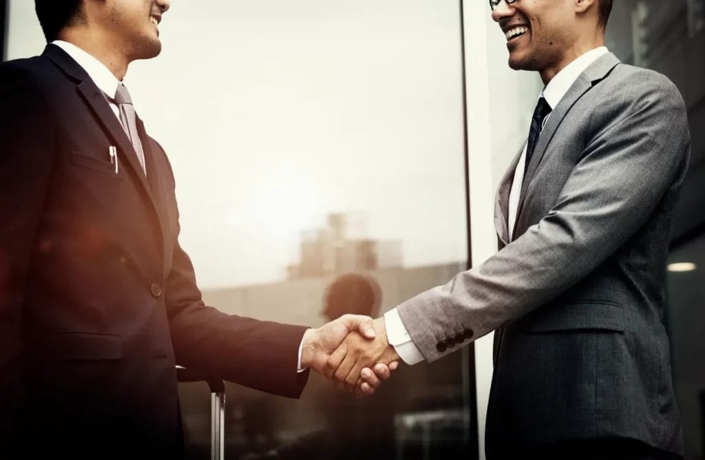 two businessmen shaking hands