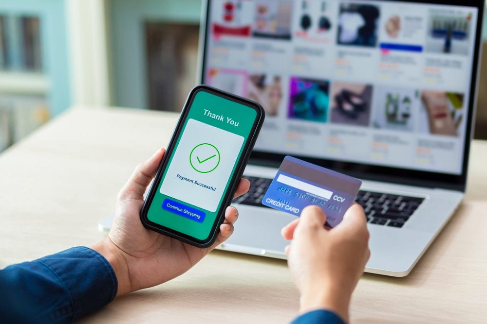 hands-using-phone-credit-card-online-payment